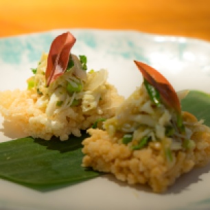 Crab with peanuts and pickled garlic on rice cakes Nahm Bangkok